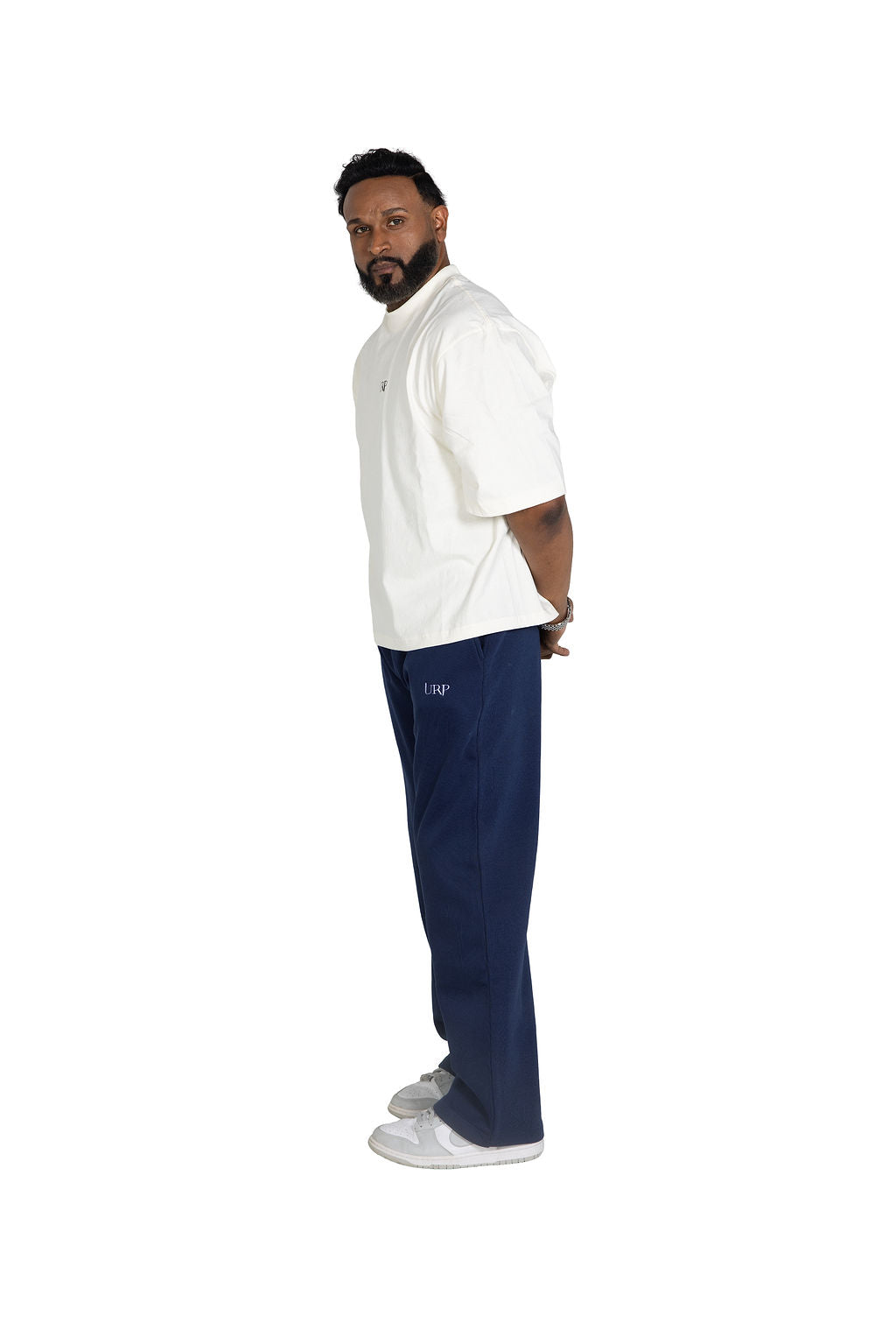 Side view of blue URP wide-leg joggers on a model.
